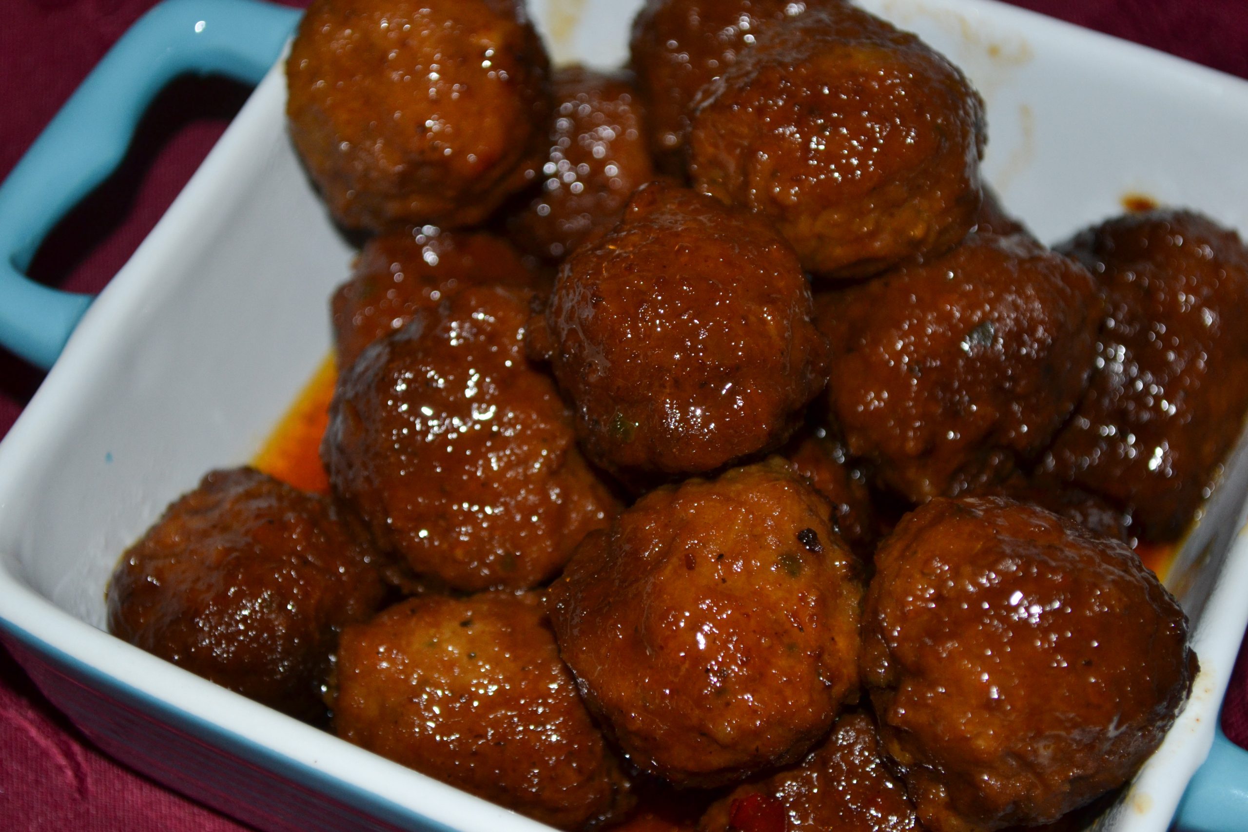 Crowd pleaser slow cooker meatballs that are sweet, tangy and juicy!